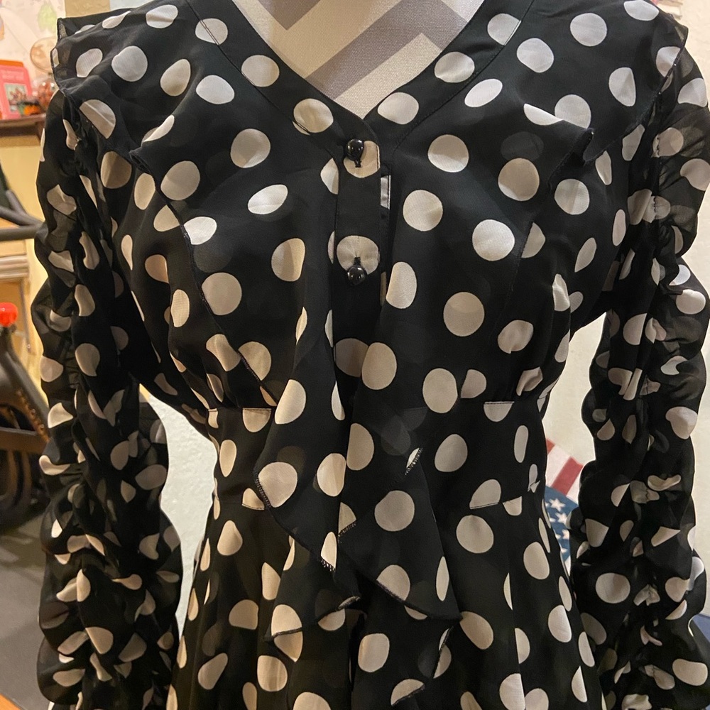 Super cute button up dress.